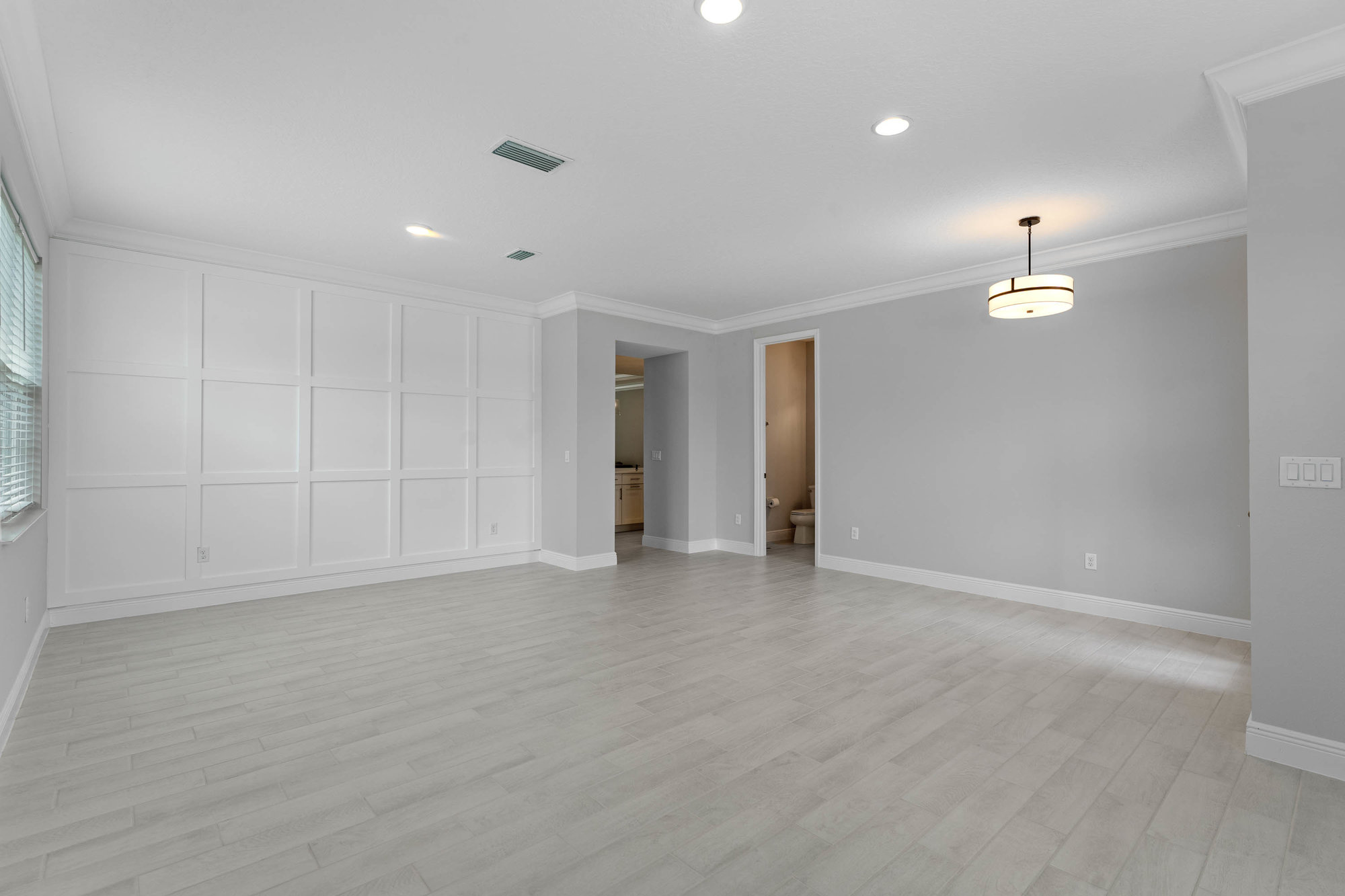 large room with modern white walls
